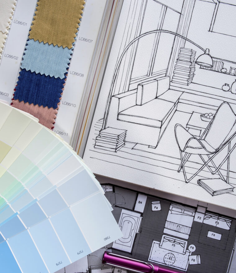 paint and fabric colour samples placed beside interior decorating sketch drawings